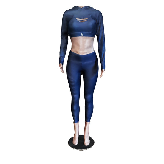 The Glow Getter 3 Piece Women’s Set in navy, displayed on a wooden floor. The set features sleek leggings with cut-out details and 'BOSS AMBITIONS' text, a cropped hoodie with a bold 'BOSS' inscription on the arm, and a strappy sports bra, all with a distinctive 'BA' logo.