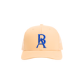 Beige cap with blue BA embroidered logo on a white background