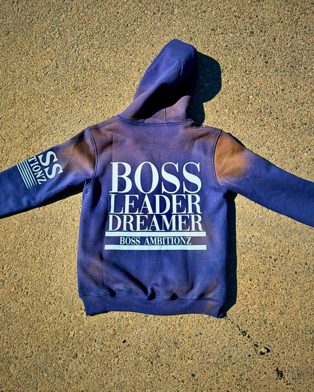 Boss Ambitionz Rustic Hustlers Rhinestone Hoodie back view with sleeve branding in navy acid-wash
