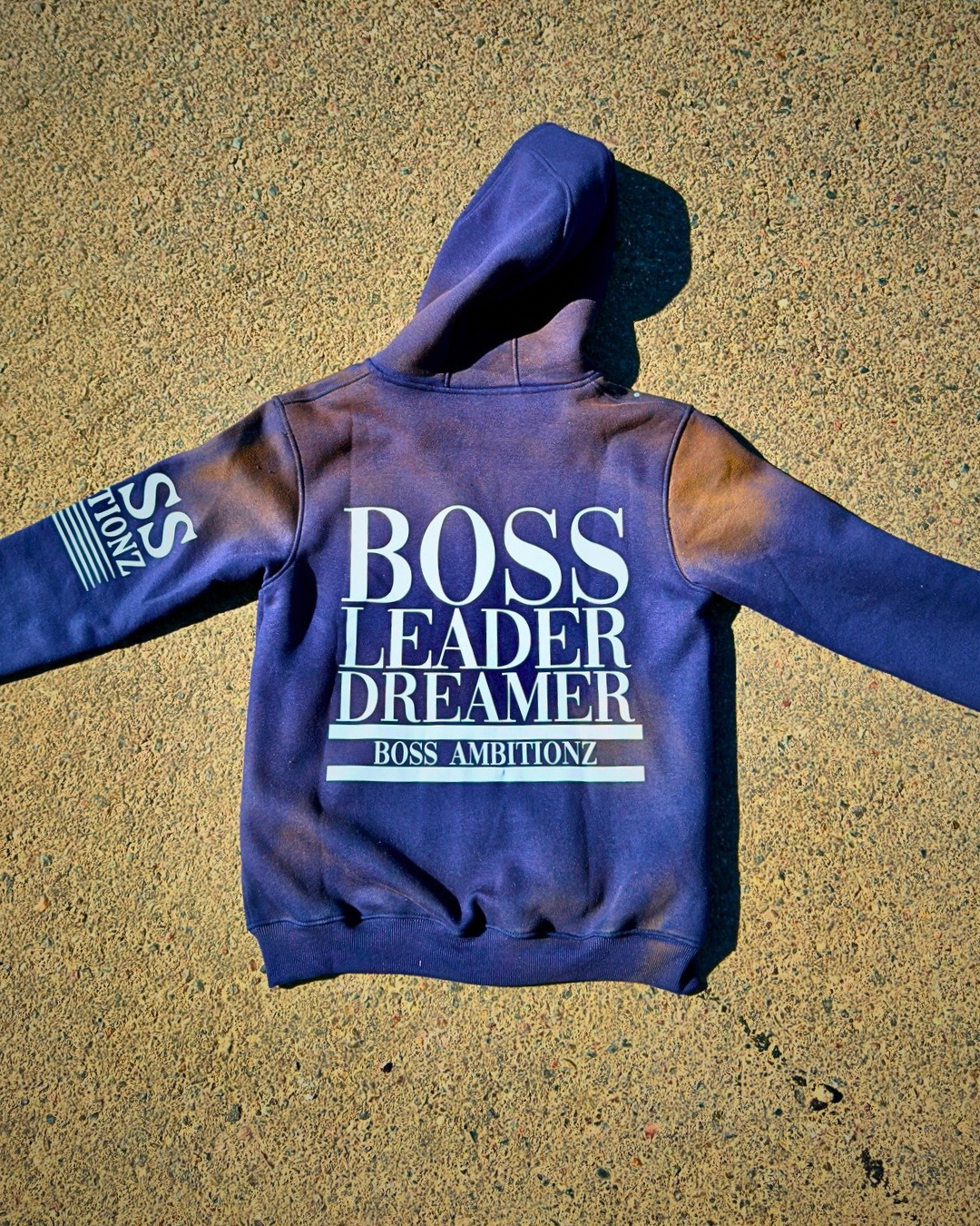 Boss Ambitionz Rustic Hustlers Rhinestone Hoodie back view with sleeve branding in navy acid-wash