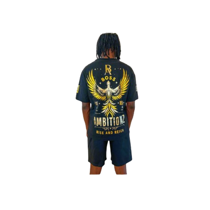 Back view of model showcasing Boss Ambitionz design: "Back view of model showcasing the Boss Ambitionz t-shirt with a striking gold winged emblem and 'Rise and Reign' slogan, paired with black shorts.