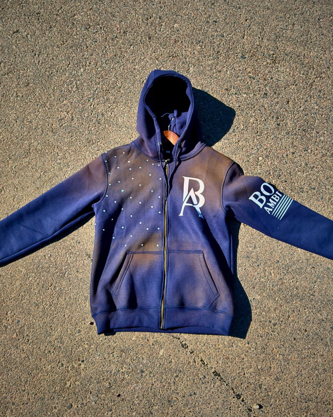Boss Ambitionz Rustic Hustlers Rhinestone Zip-Up Hoodie front view navy with rhinestones and BA chest logo