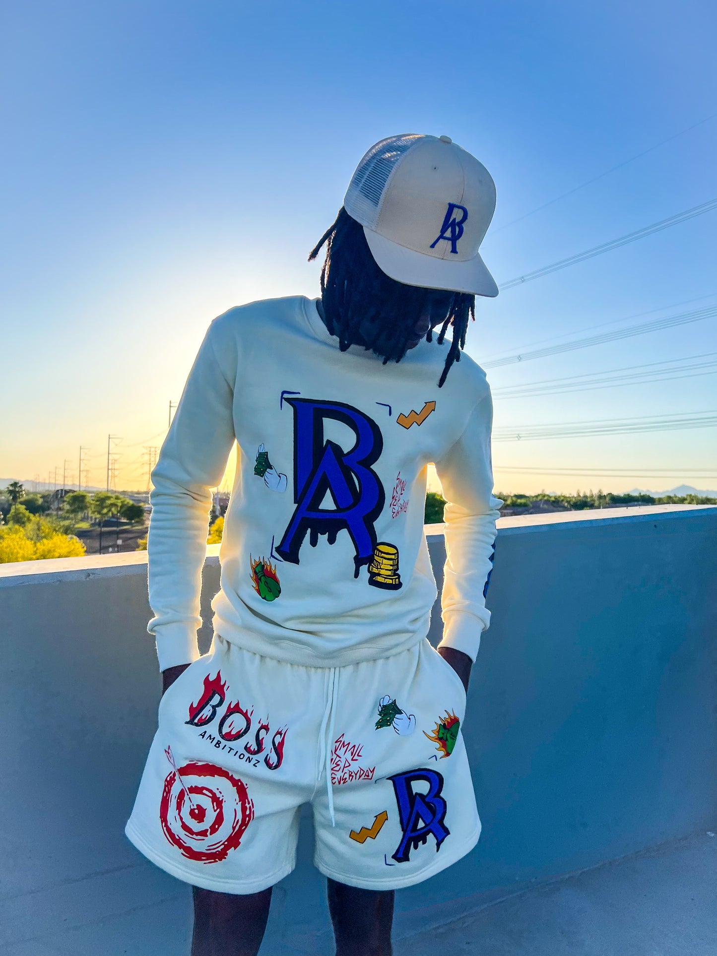 Dakidswagg rocking the new HIghrise trucker hat and Cream Legacy Luxe shortset by Boss Ambitionz