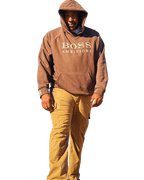 AveryBizMagent showcasing the Mocha and Cream Ultra Heavyweight hoodie. Standing in a powerful stance with one leg in front of the other against a transparent background. 