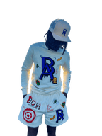 Model wearing cream Legacy Luxe Ensemble by Boss Ambitionz