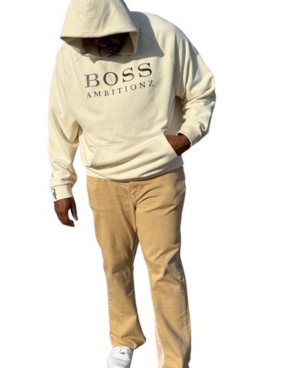 AveryBizMagent showcasing the Creme Burlee hoodie. Boss Ambitionz written across the chest with the letter BA on the right wrist. 