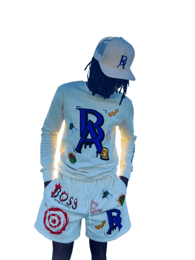 Model showcasing the Signature Trucker Hat by Boss Ambitionz and wearing the Cream Legacy Luxe Ensemble.