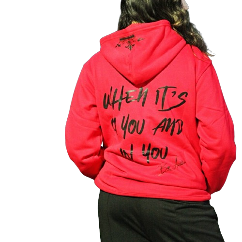 Rihanna showcasing the back of red Boss Ambitionz Ambition Crown Hoodie