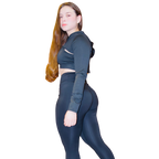 Ruby.G standing in fierce side pose showcasing Boss Ambitionz Glow-Getter Reflective Exclusive: Women's 3 Piece Gym Set