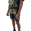 Close-up view of DaKidswagg in Boss Ambitionz shorts: "Close-up view of DaKidswagg wearing Boss Ambitionz shorts, highlighting the bold gold 'Boss Ambitionz' text and logo on the leg.