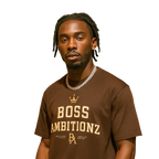 Man wearing a brown 'BOSS AMBITIONZ' t-shirt on a white background